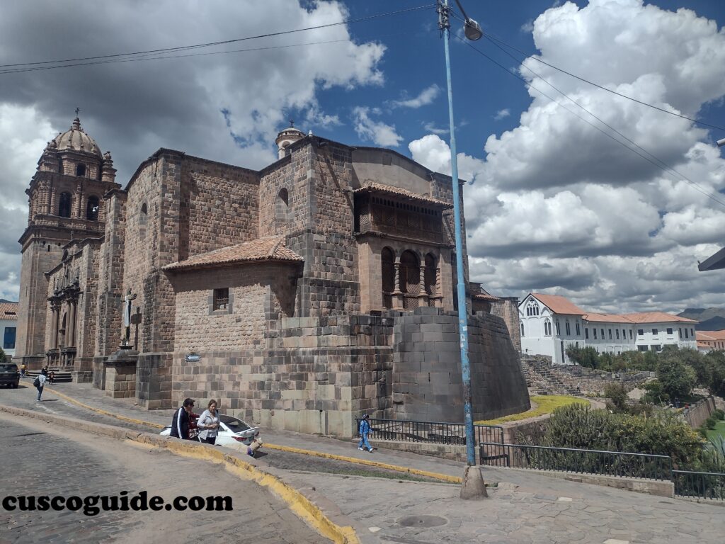 Qoricancha Sun Temple exterior in Cusco with Inca stone walls and colonial church
