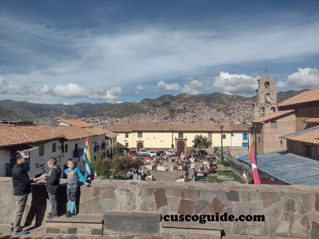 Panoramic view of San Blas Square in Cusco, Peru, showing colonial architecture and lively streets