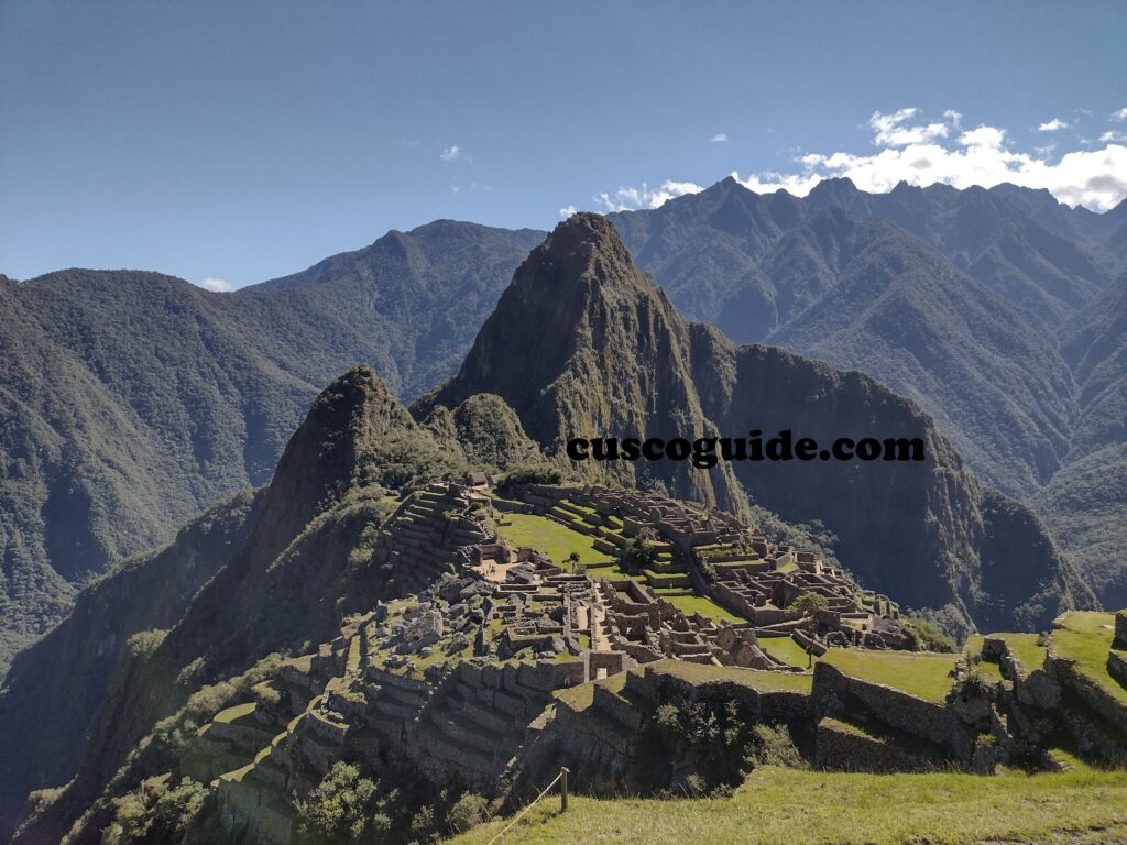 A majestic view of Machu Picchu, with the iconic ruins framed by Huayna Picchu and the surrounding lush Andean landscape.